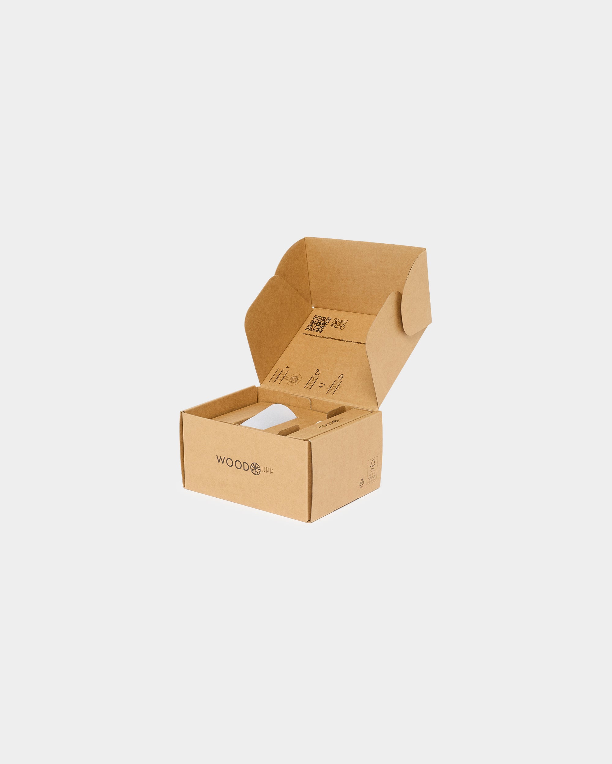 Open brown cardboard box displaying the WOODUP logo, showing eco-friendly packaging with lid open, on a plain white background. Interior is visible.